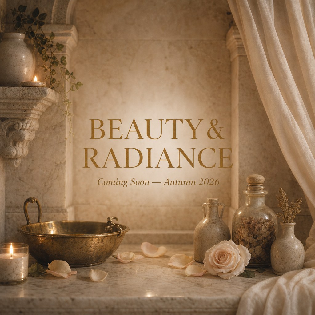 Beauty & Radiance collection — brass vessels, roses, and candles on marble